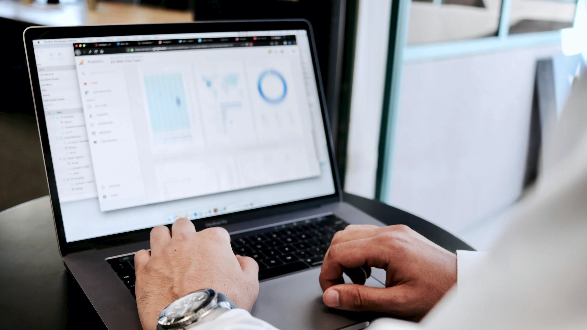 Person working on a laptop with a CRM dashboard
