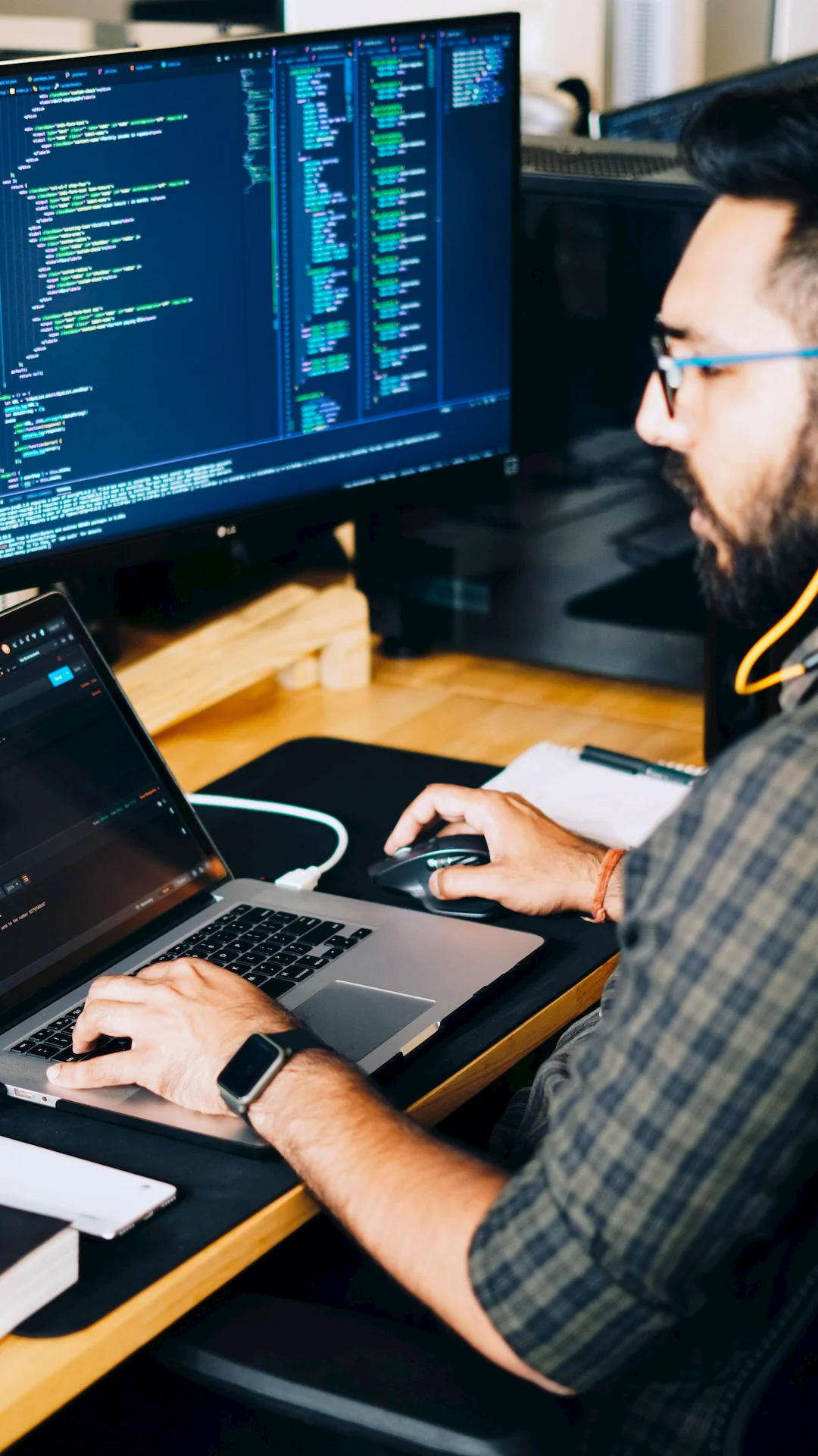 Developer focused on code across several screens